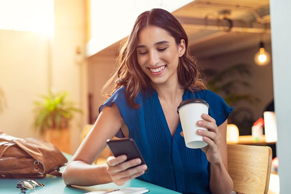 A woman enjoys her mobile experience because of CRO